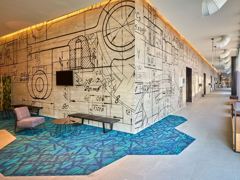 Hotel lobby hallway with modern art walls, La Colección Resorts