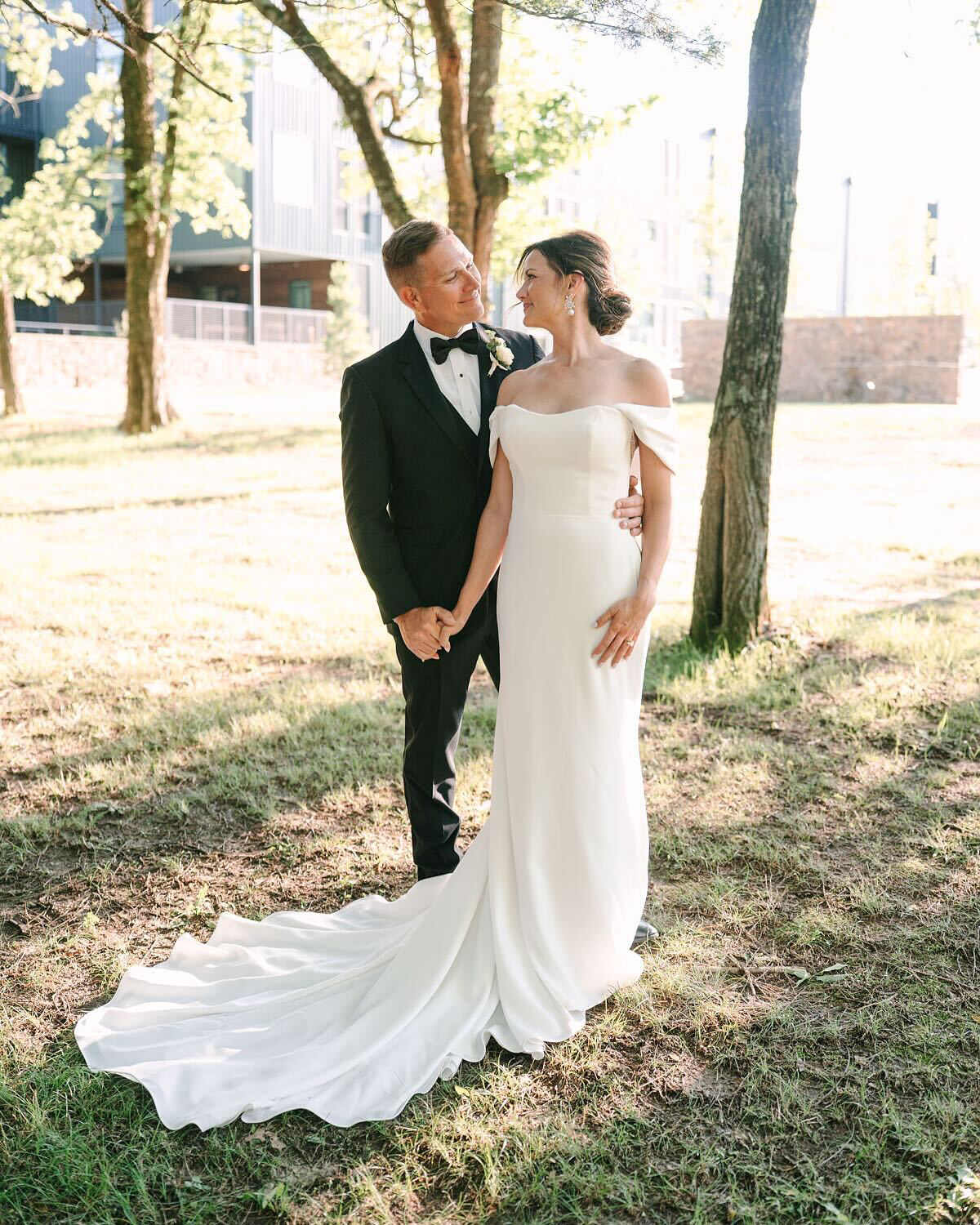 A newly wed couple posing with a loving gaze at each other