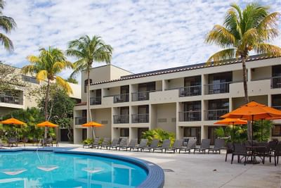 tables and lounge chairs near pool