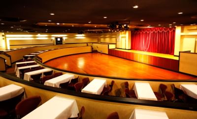 Theatre seats with stage in Atlantic Hall at Honor’s Haven Retreat