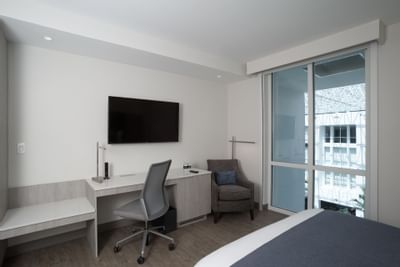 Work Desk & Chair with TV in Queen Room at Innovation Hotel