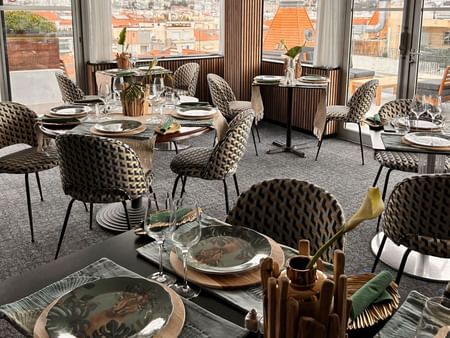 Interior view of The Jungle Restaurant with arranged dining tables at Splendid Hotel & Spa Nice