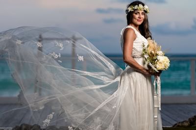 A Bride posing to the camera near Bougainvillea Barbados