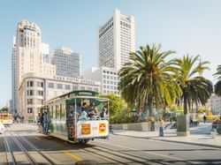 People traveling by bus near The Garrett Hotel