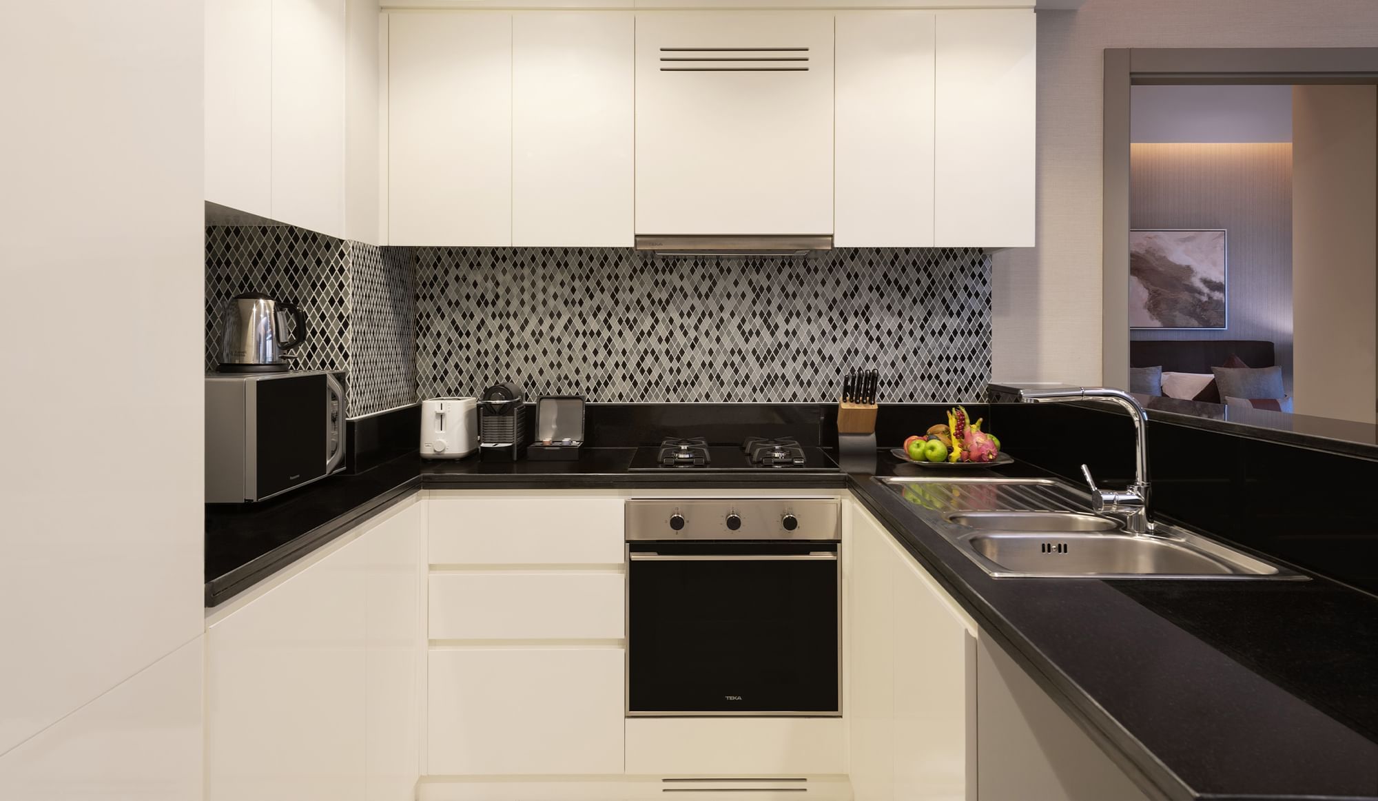 Luxury kitchen area with appliances at DAMAC Maison Aykon City