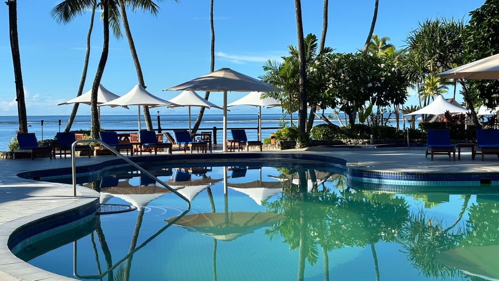 Blue swimming pool with ocean view at Warwick Fiji Resort and Spa, Korolevu.