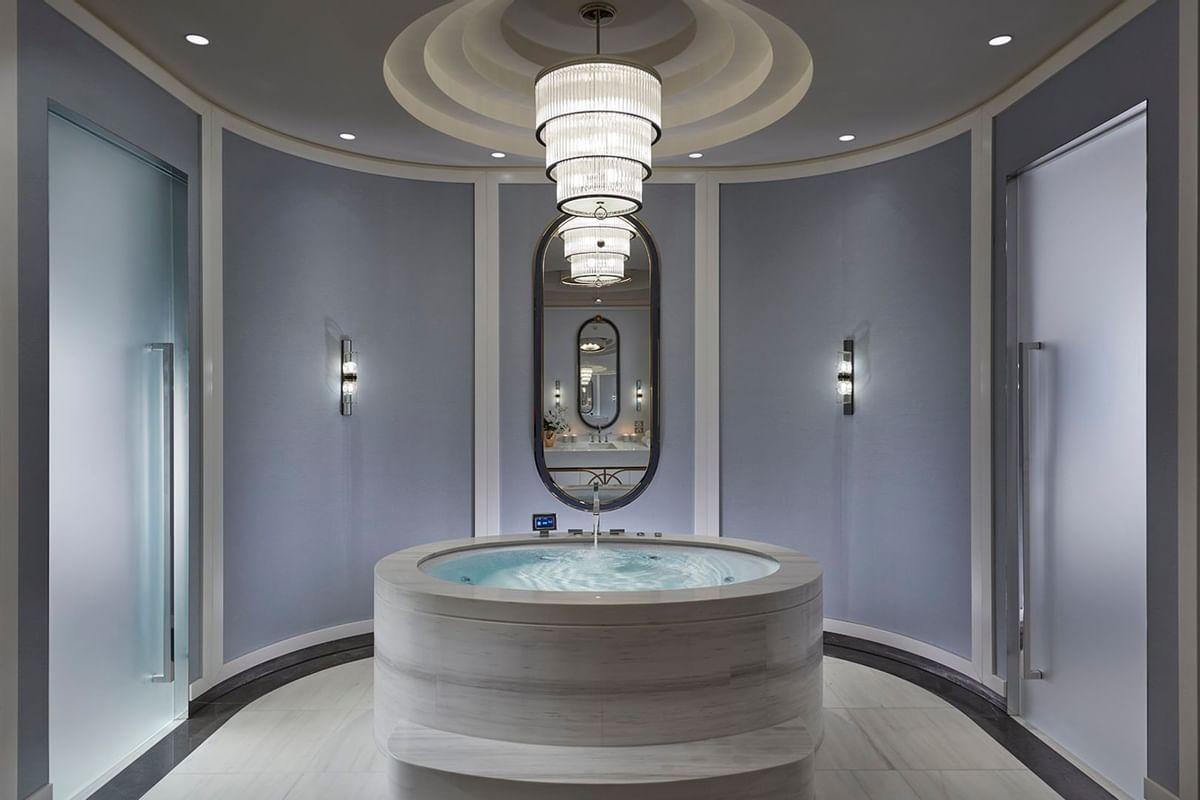 A jacuzzi & chandelier in a spa at Crown Hotel Perth