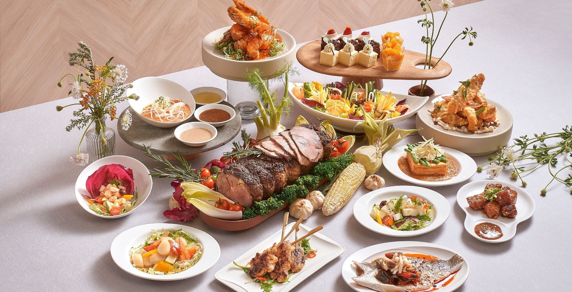 Cafe Mosaic buffet spread with a perfectly roasted beef loin and many colorful side dishes at Carlton Hotel Singapore