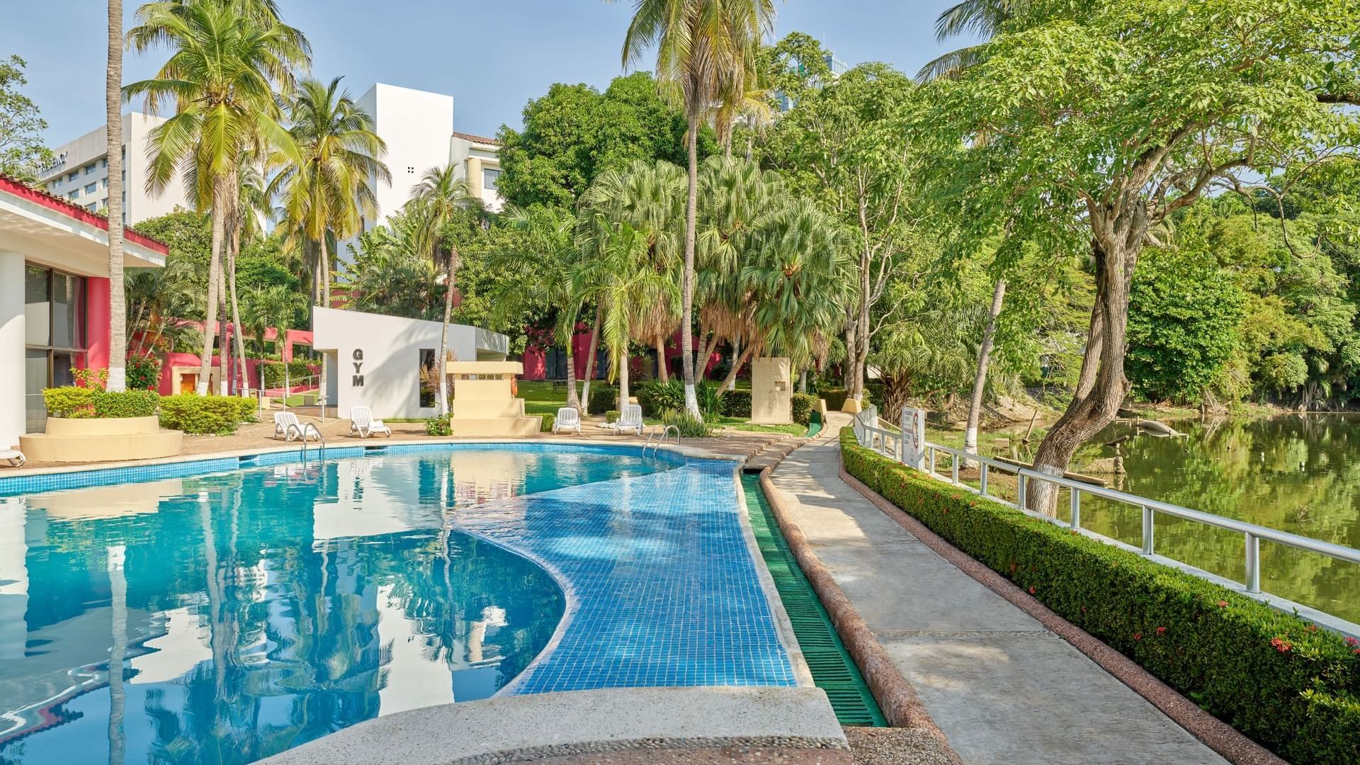Outdoor swimming pool area at Fiesta Inn Villahermosa Cencali
