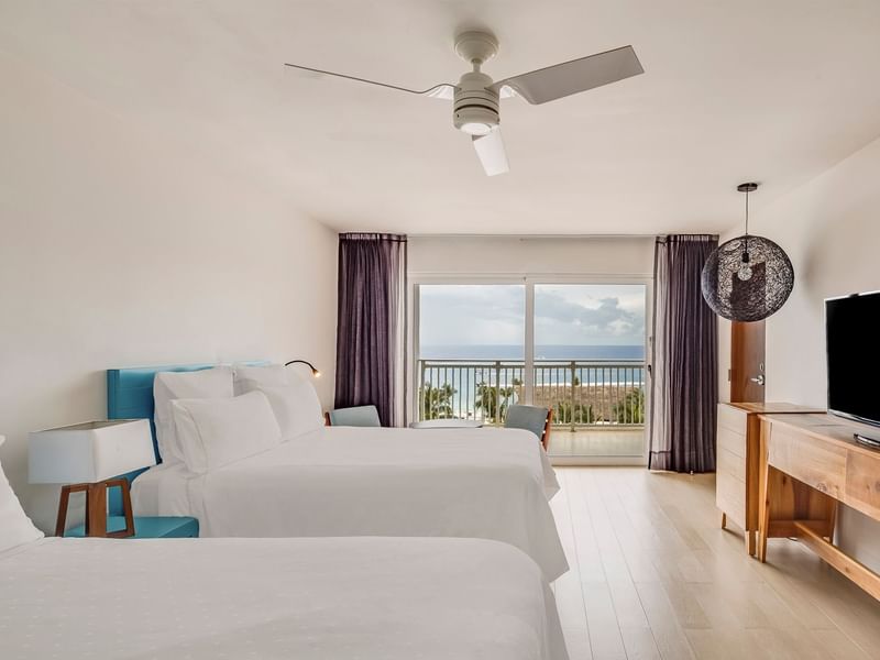 Governor Suite with 2 double beds and a TV in Wooden flooring at Fiesta Americana