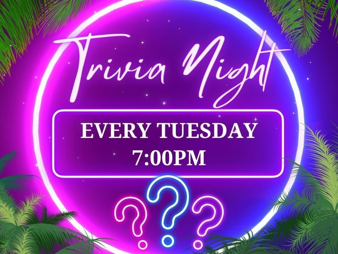 Purple neon sign with question marks 