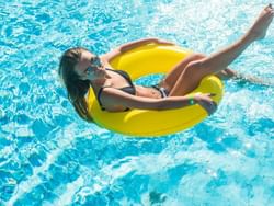 A lady on a float at Universal's Volcano Bay near Mystic Dunes Resort