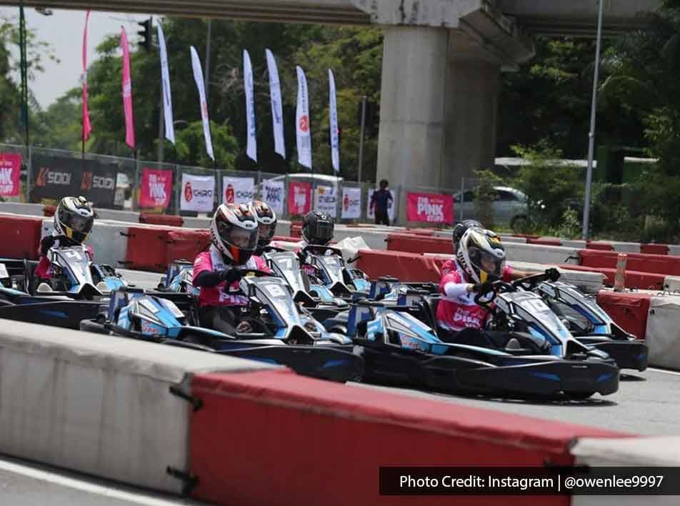 go kart racers speeding around the track - Lexis MY