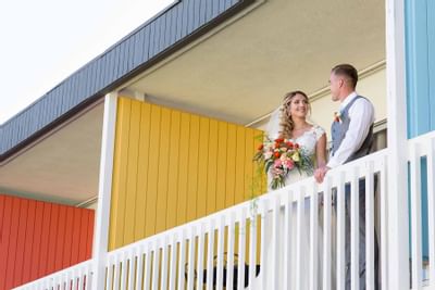 A wedded couple posing in the hotel terrace at Anaheim Hotel