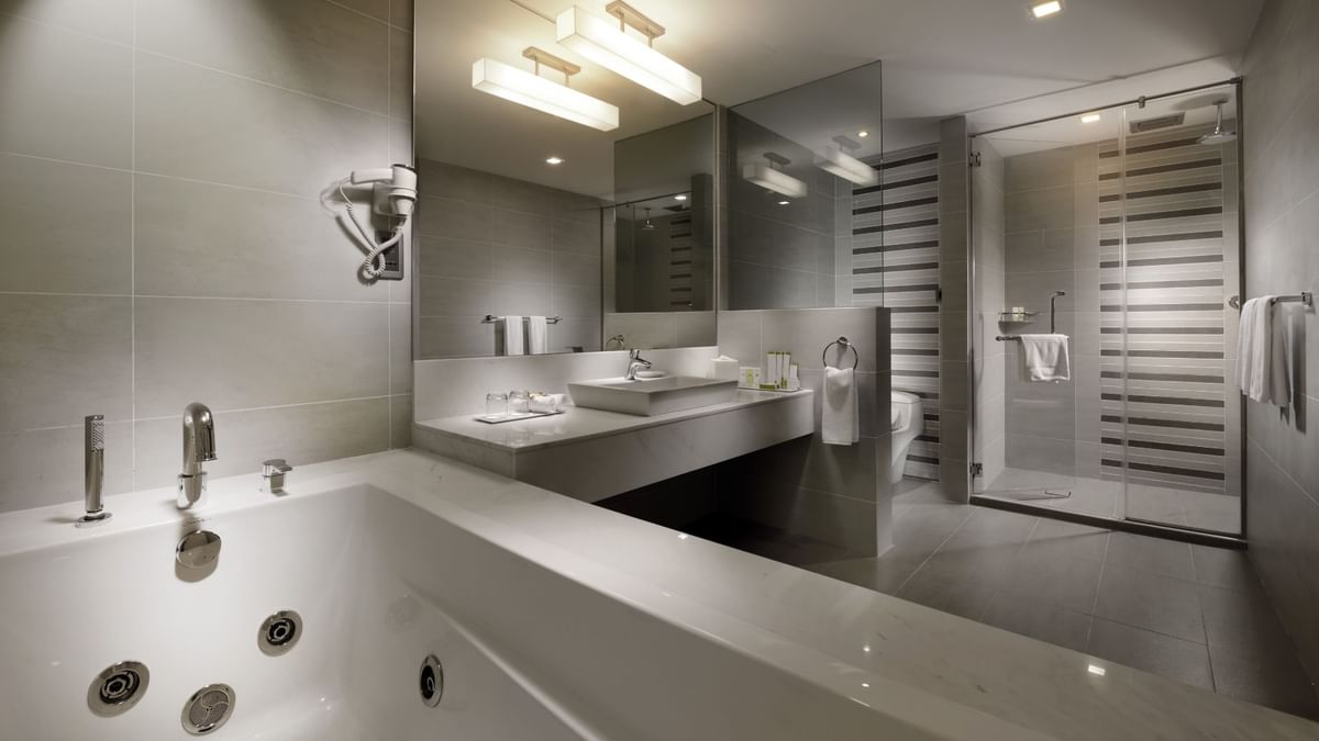 Luxury king bed in Royal Villa with a warm embrace at The Banjaran Hotsprings Retreat