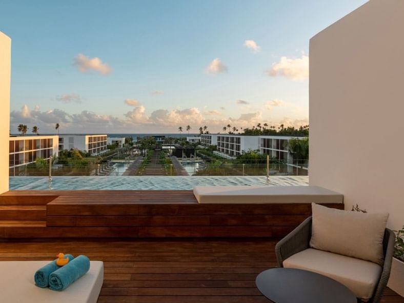 Balcony lounge area by the infinity pool at Live Aqua Punta Cana