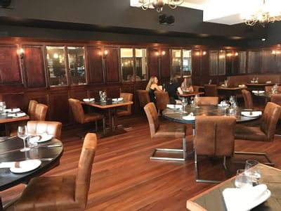 Comfy dining area in Otis Restaurant at Knightsbridge