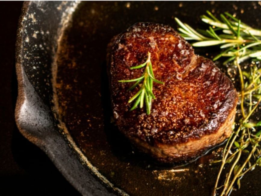 Steaks served with rosemary in Rare Steakhouse at Brady Apartment Hotel Flinders Street