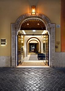 Exterior view of a Margutta 19 hotel entrance at night