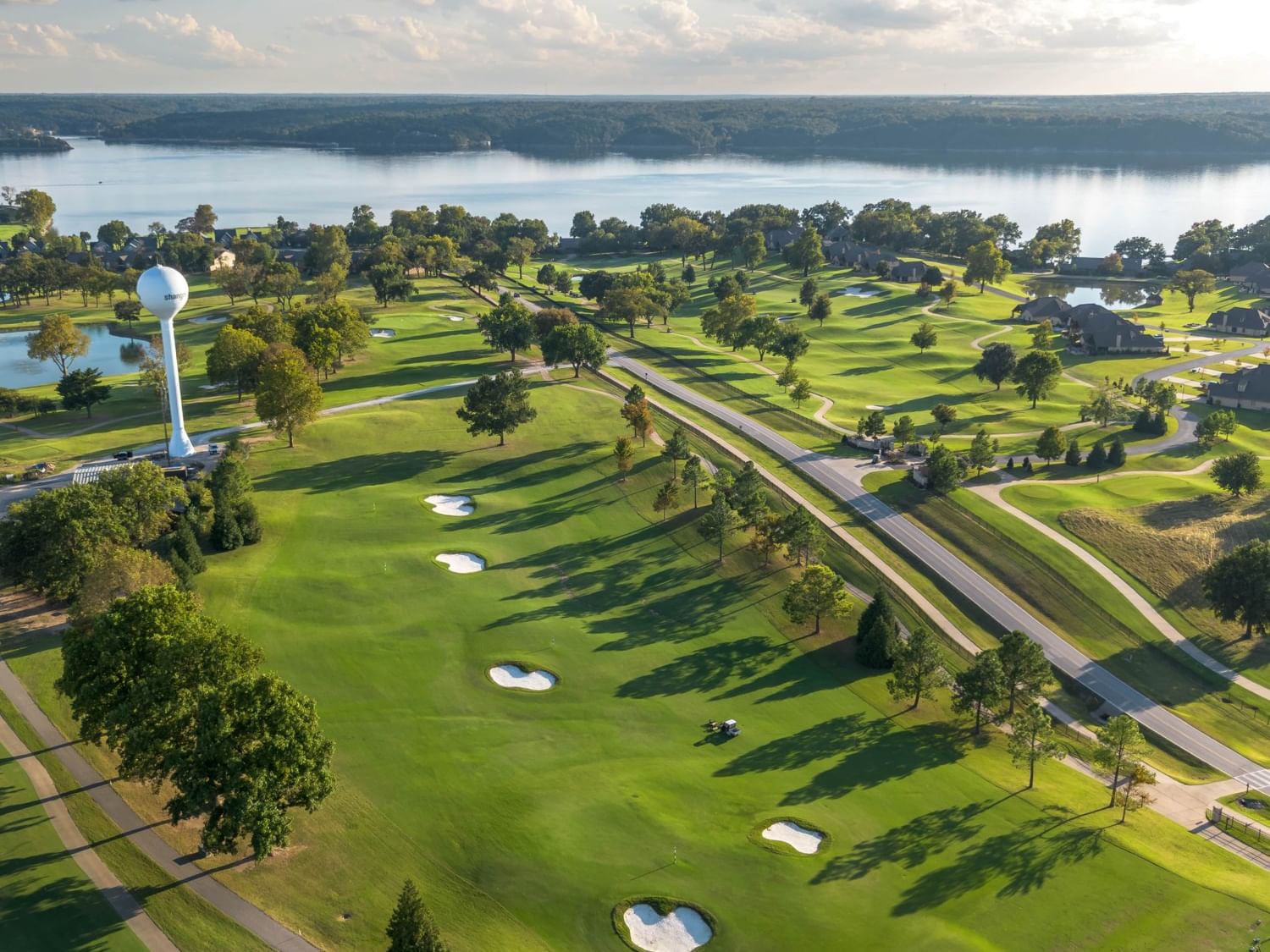 Aerial view of Heritage Nine golf course with a lake at Shangri-La Resort