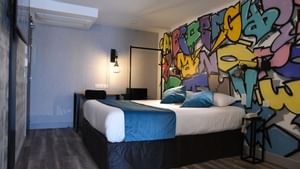 Interior of a bedroom with wall decors at Originals Hotels