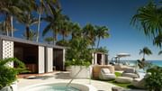 Elevated beach club with shaded cabanas and tropical landscaping.