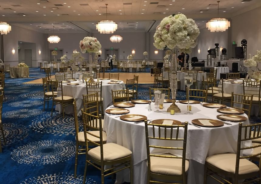 Ballroom set for a wedding the flower centerpieces