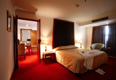 Bed with headboard in Princess Suite at Amora Hotel Chiang Mai