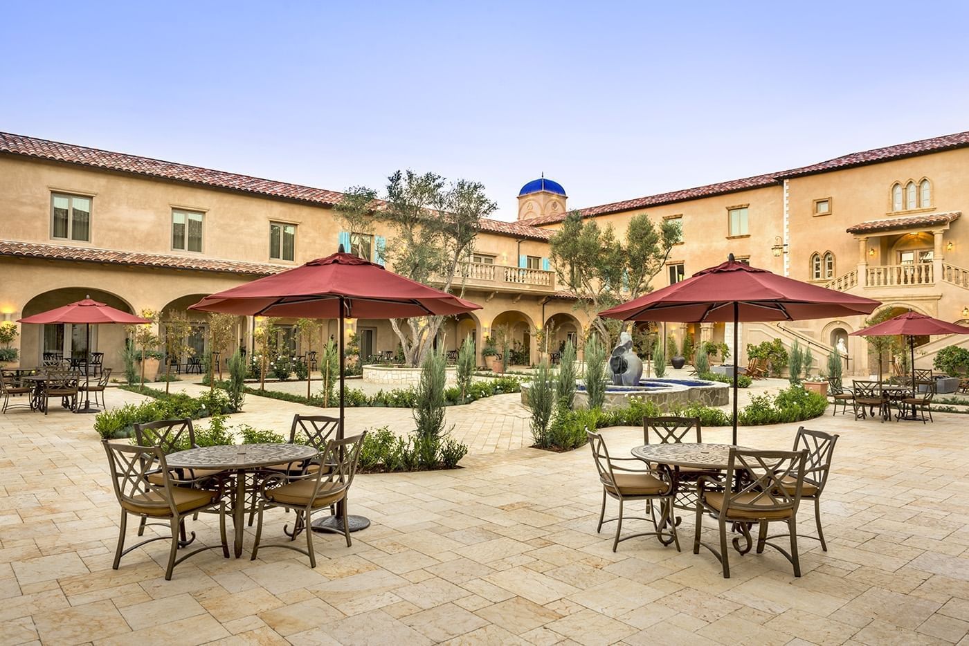 Courtyard at Allegretto Vineyard Resort with round table seating