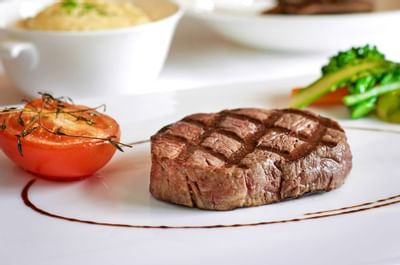 Closeup of a grilled piece of beef served at Goodwood Hotel