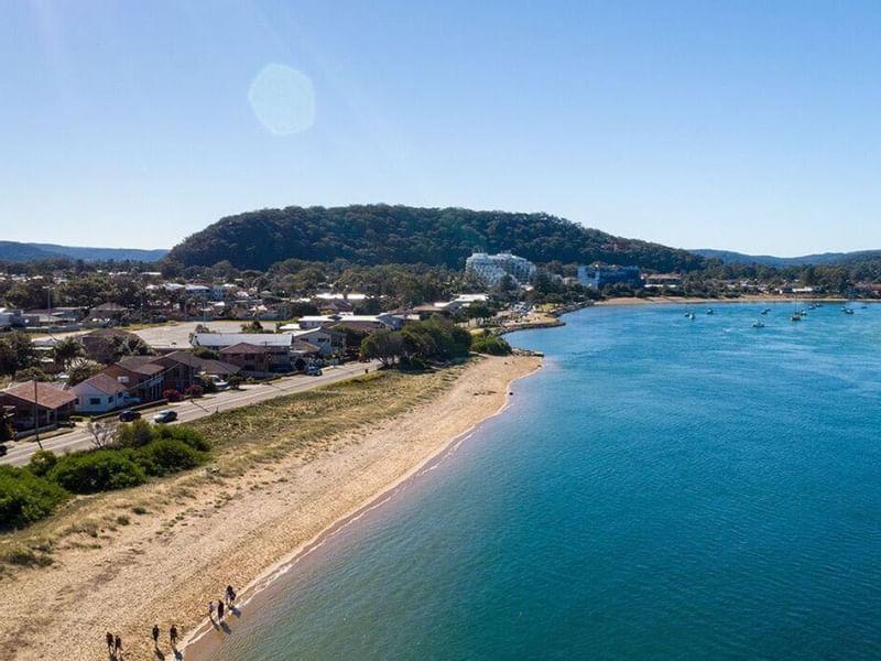 Distant view of Ettalong Beach Markets near Pullman Magenta Shores