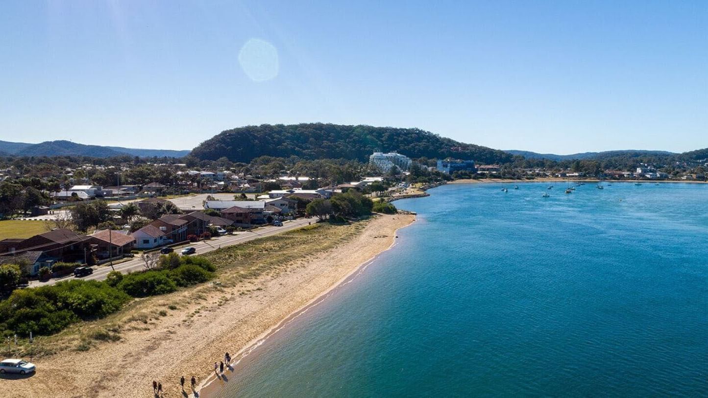 Distant view of Ettalong Beach Markets near Pullman Magenta Shores