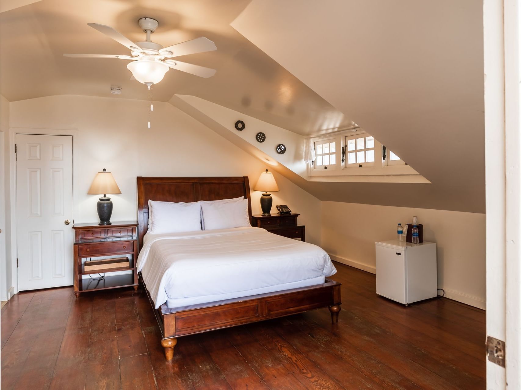 One queen bed and side tables in Crows Nest at Banning House Lodge, one of the places to stay in two harbors