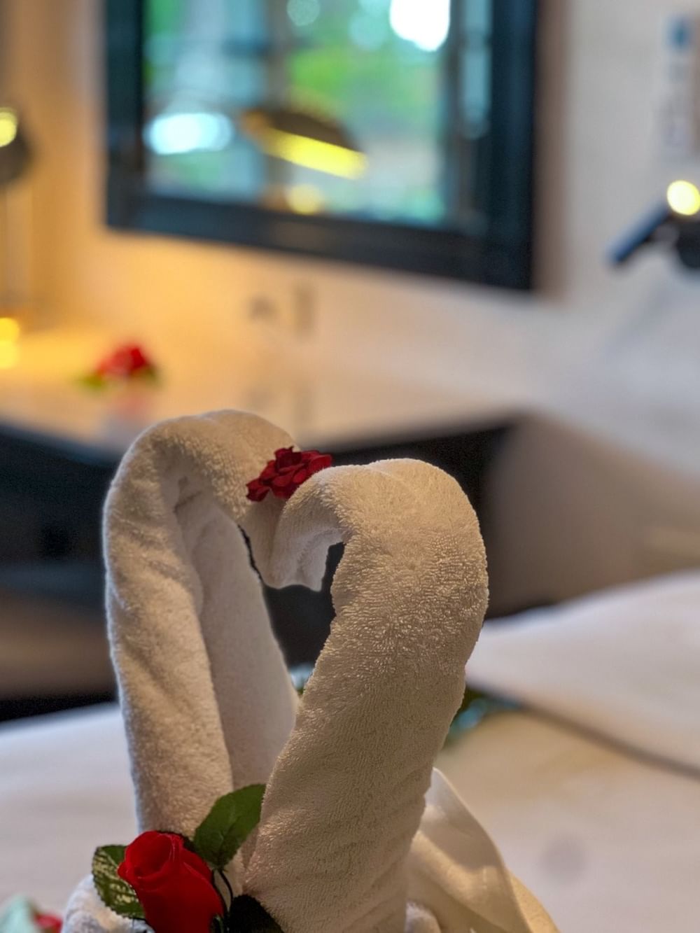 Decorative towel swans on bed in One Bedroom Villa at Tokatoka Resort Nadi Fiji International Airport.