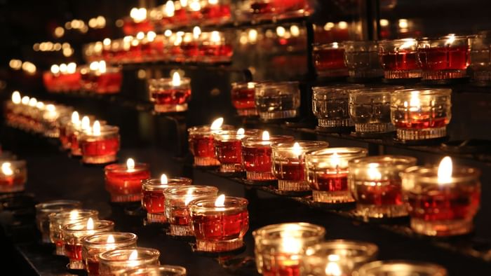 Lighted up lamps in Solesmes Abbey near Originals Hotels