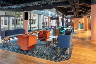 Lobby lounge area with wooden interior at Amora Hotel Melbourne