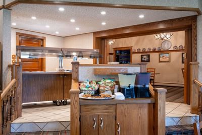 Buffet area at The Ranch at Ucross, offering snacks, beverages, and a view into the dining room