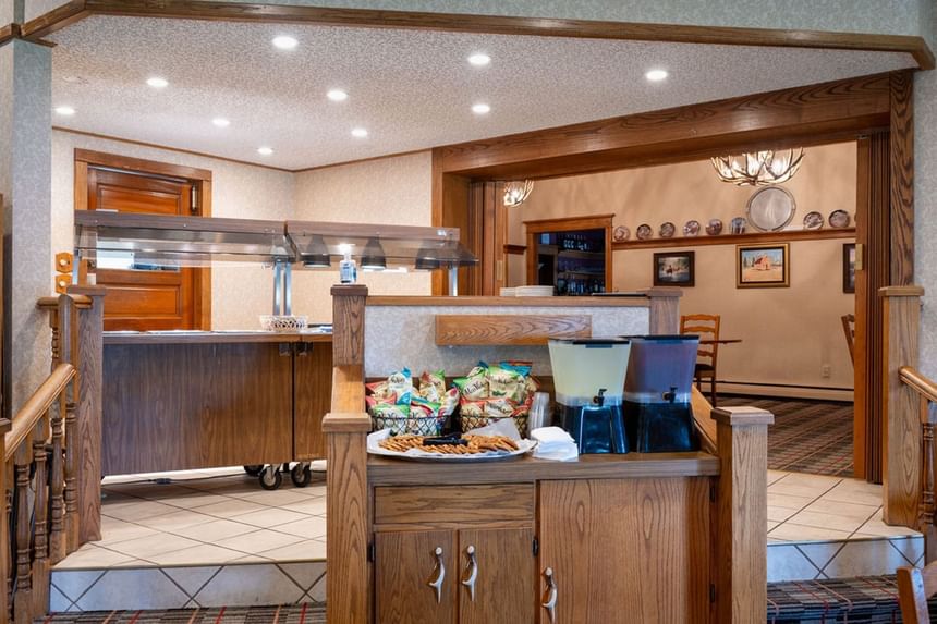 Buffet area at The Ranch at Ucross, offering snacks, beverages, and a view into the dining room