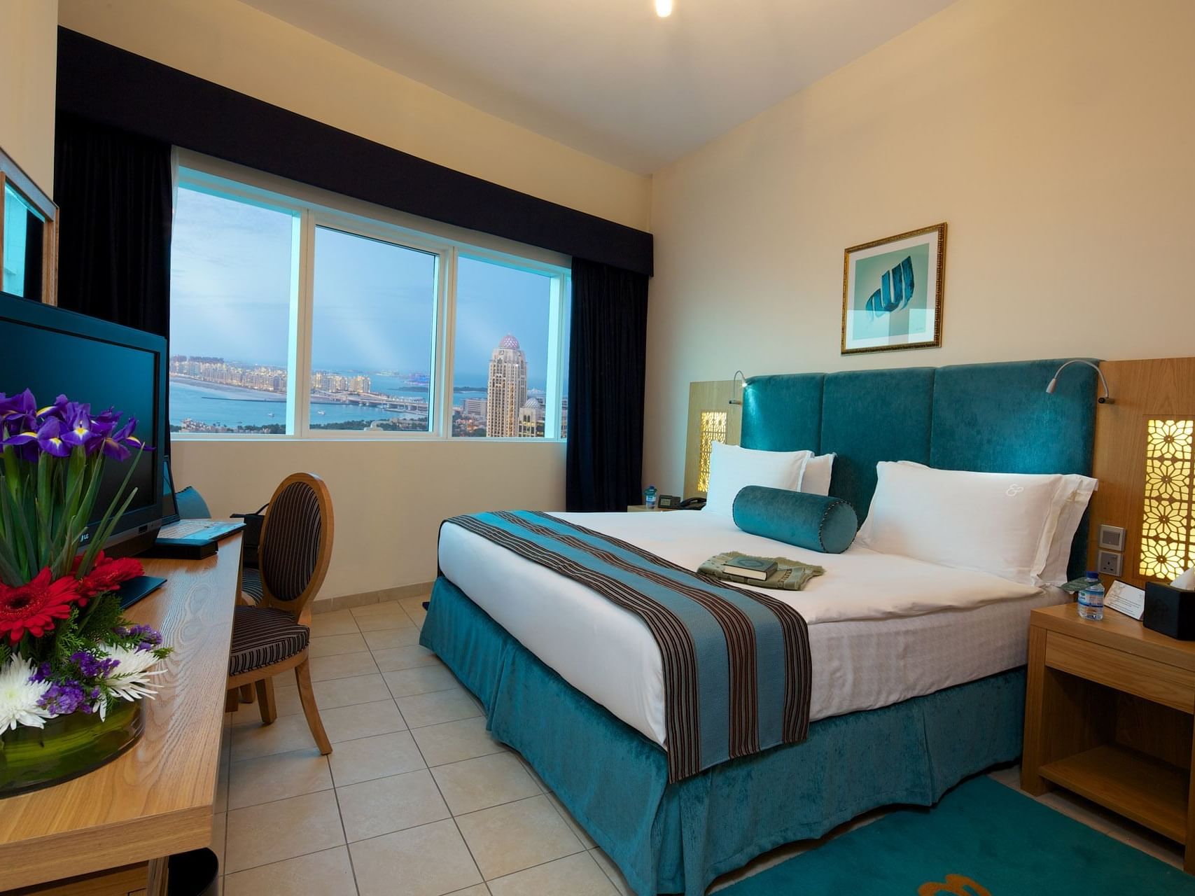 Interior of three bedroom suite with bed at Tamani Marina Hotel