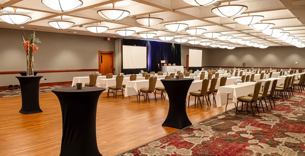 Coast Edmonton Plaza Hotel by APA Meeting Room with chair, table, decoration, and presentation screen