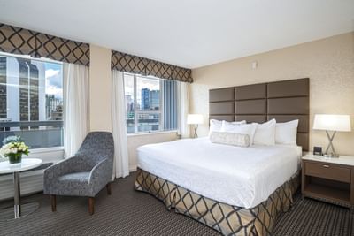 Bed and chair in hotel room