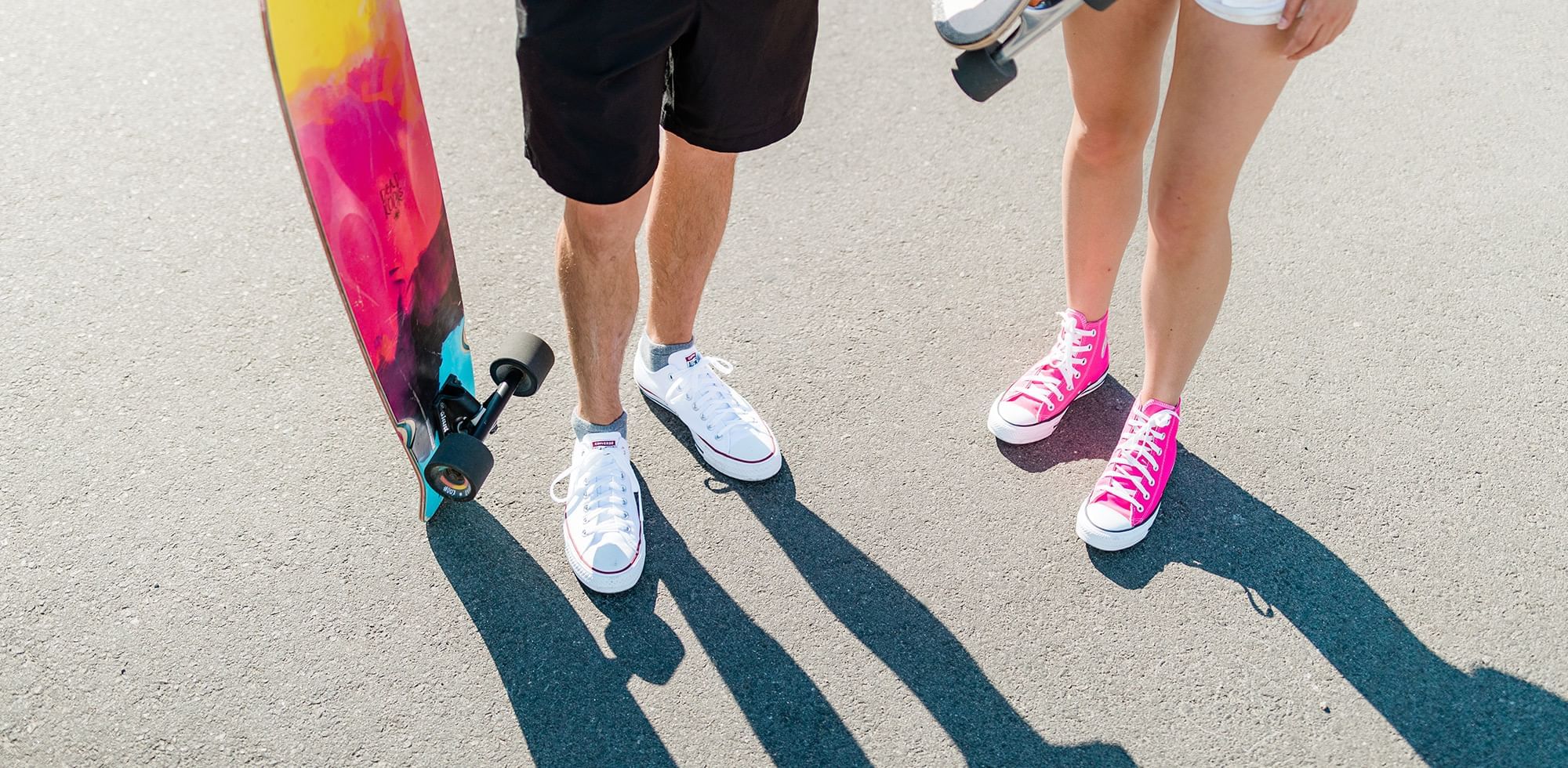 feet of a man and women with a skateboard