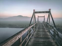 Misty lake view from a wooden bridge near Quartier Des Marinas