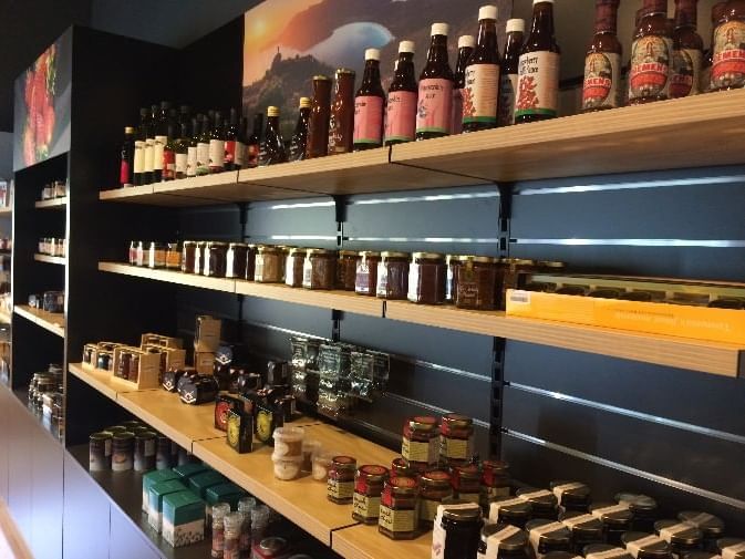 An inventory display shelf at the shop near Freycinet Lodge