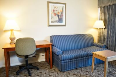 Working desk next to the sofa in 1King Bed Suite at Buena Vista