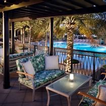 Pool front dining area in Giardino at Palazzo Versace Dubai