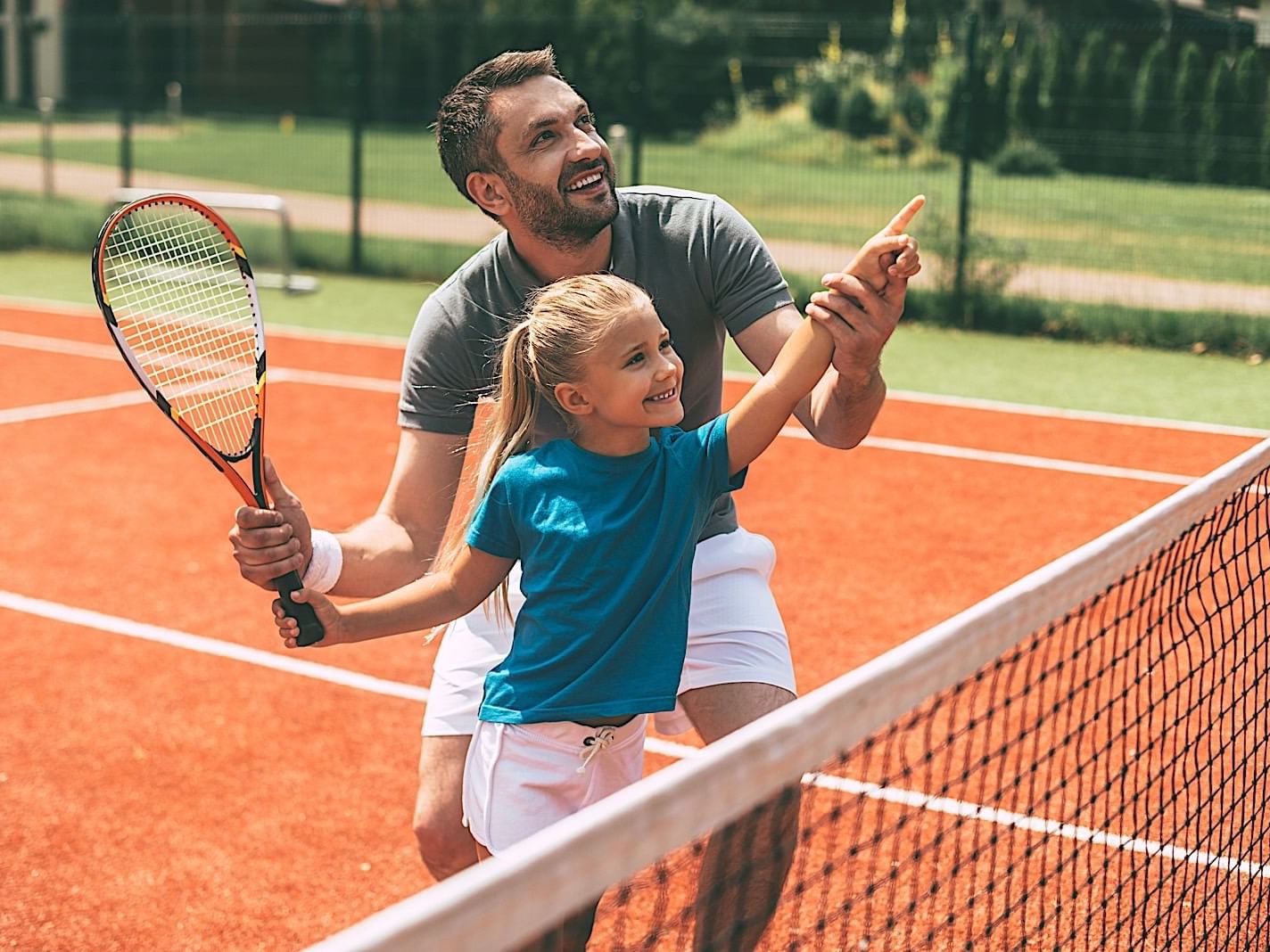 Father & daughter playing tennis at Princess Mundo Imperial