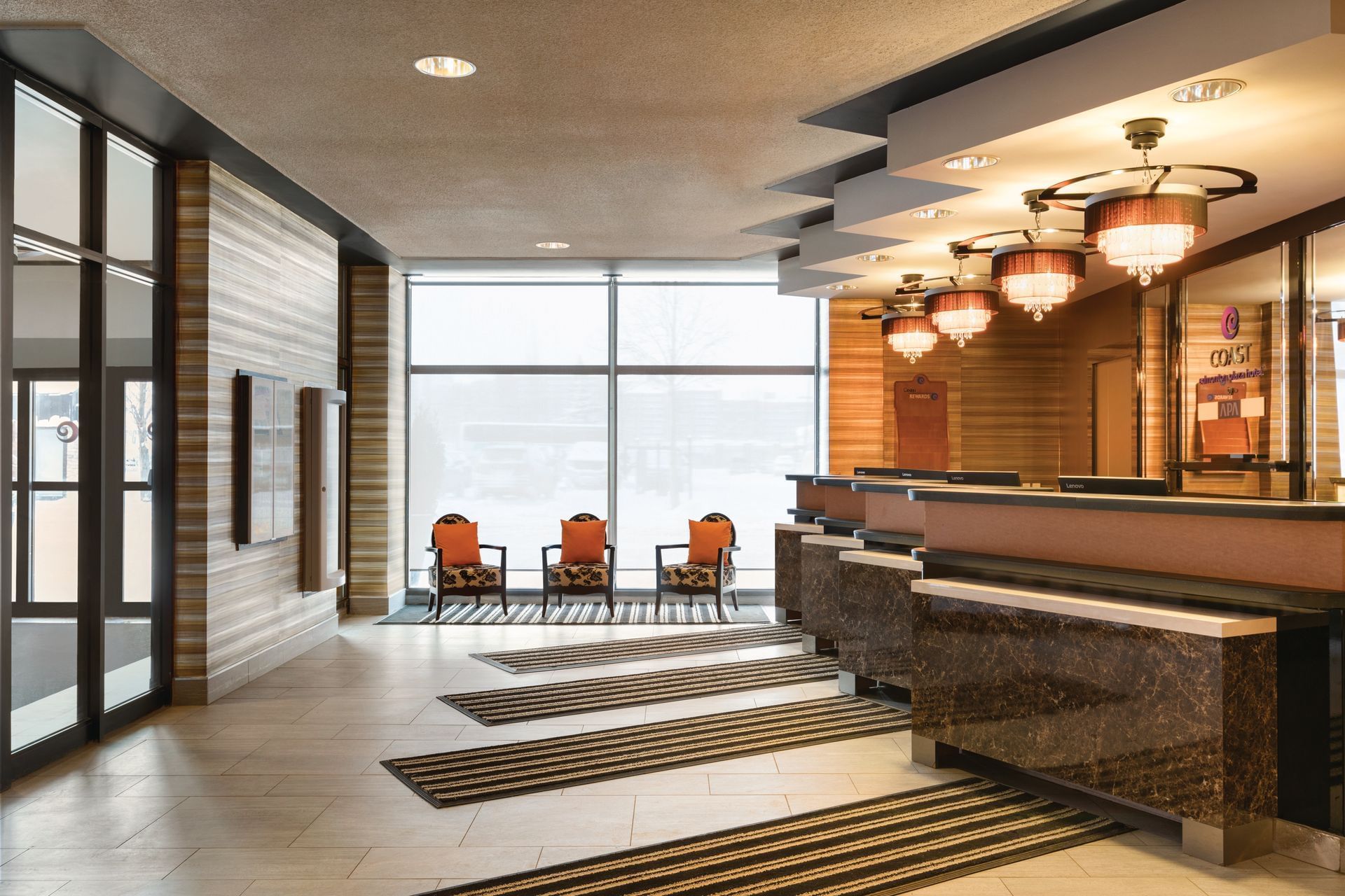 Lobby area of Coast Edmonton Plaza Hotel by APA