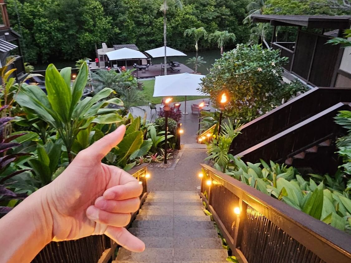 Close-up of dope hand gesture by the outdoor stairway at Paradise Bay Resort