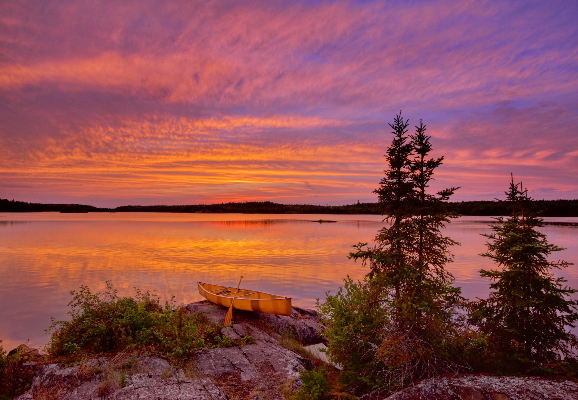 Boat by the lake near Bluefin Bay Family of Resorts